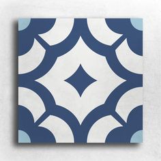 a blue and white tile pattern on the wall