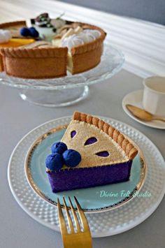 a slice of pie on a plate with a fork next to the rest of the pie