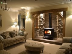 a living room filled with furniture and a fire place in the middle of the room