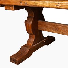 a close up of a wooden bench with no one on it's legs or feet