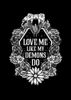 the words love me like my demons do on a black background with flowers and leaves