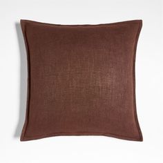 a brown pillow on a white background