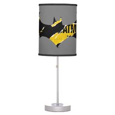 a batman lamp with the word bat on it's side and yellow lettering in black