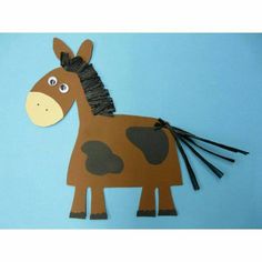 a brown paper horse with black manes on blue background