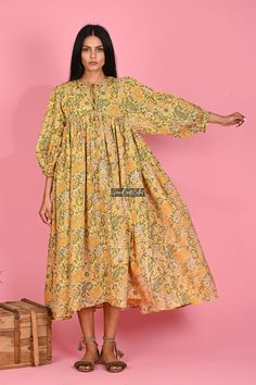 "Printed Cotton Dress, Long Women Dress, Cotton Maxi Dress, Flower Print Dress, Indian Tunic Dress, Block Printed Dress, Boho Dress, Sale Material ~ 100% Cotton gauze. Care ~ Gentle hand wash. Air dry in shade. Made ~ India OUR SIZE GUIDE Please use the following measurements and information as a guide to find the best fit for you so you can flow effortlessly in Indianavogue. MEASUREMENT PREFERENCE Size Chart in Inches:- Size S - Bust-40\" Size M - Bust-42\" Size L - Bust-44\" Size XL - Bust-46\ Yellow Floral Print Knee-length Dress, Spring Beach Dress With Kalamkari Print, Yellow Bohemian Dress With Floral Print, Yellow Bohemian Boho Dress With Floral Print, Yellow Boho Dress With Floral Print For Vacation, Summer Tunic Dress With Kalamkari Print, Spring Beach Dresses With Printed Motifs, Yellow Floral Cotton Maxi Dress, Spring Vacation Dresses With Printed Motifs