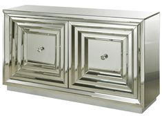 a silver cabinet with two square mirrors on it