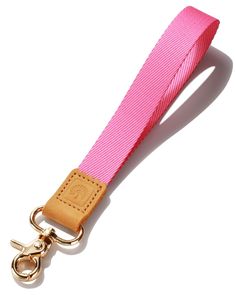 a pink lanyard strap with gold hardware on a white background for use as a key fobring