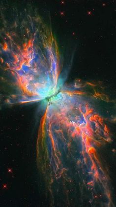 a butterfly shaped object in the middle of space with bright colors and stars around it