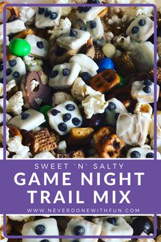 a bowl filled with blueberries and marshmallows next to the words game night trail mix