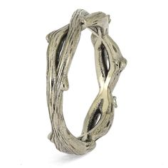 a silver ring that has been made out of wood and is shaped like a tree branch