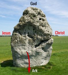 a large rock in the middle of a field with words above it that read, god jesus christ ark