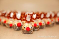 a group of glass ornaments with red noses on them