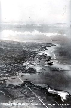 an aerial view of the ocean and land