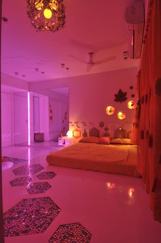 a bed room with a large bed and lots of lights