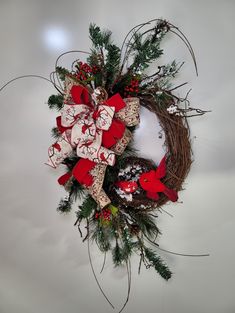 a christmas wreath with bows and decorations