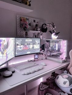 two computer monitors sitting on top of a white desk