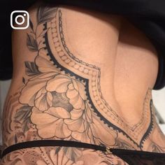 the back of a woman's lower body with flowers on it