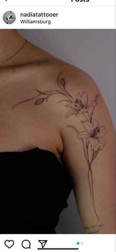 a woman's shoulder with flowers on it