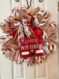 an old fashioned hot cocoa sign is hanging on the front door to give it a festive touch