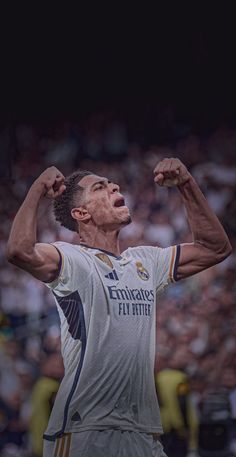 the soccer player is celebrating his team's win in front of an excited crowd