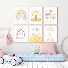 a child's bedroom with pink and blue decor, including posters on the wall