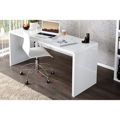 a white desk with a computer on it