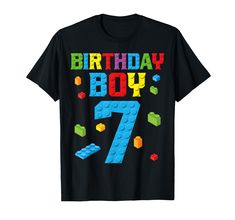 a black birthday shirt with the number seven in legos and blocks on it's chest