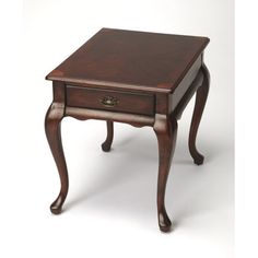 a small wooden table with one drawer on it