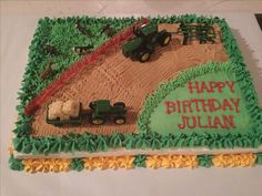 a birthday cake with tractor and farm scene on it