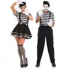 two people dressed as mime and clowns are posing for the camera with their hands on their hips