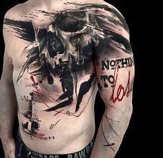 a man's back with tattoos and words written on it, including an eagle