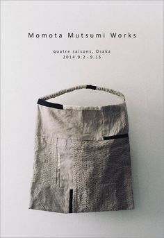 a bag hanging up on the wall with text above it that reads molota museum works