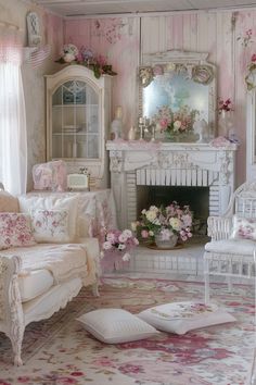 a living room filled with furniture and flowers on the fireplace mantel in front of a mirror