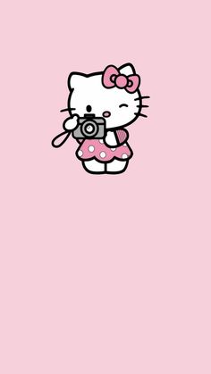 hello kitty wallpaper pink photographer Hello Kitty Taking A Picture, Cute Icons Hello Kitty, Hello Kitty Holding Flag, Hellokittycore Wallpaper, Hello Kitty Fanart, Pink Aesthetic Hello Kitty, Bouquet Toppers, Lash Babe, Happy Raksha Bandhan Images