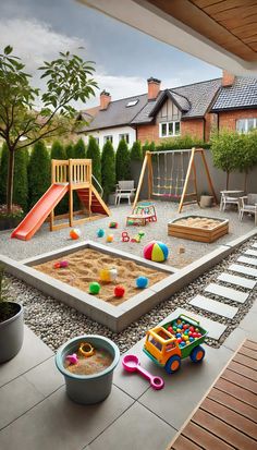 an outdoor play area with toys and sand