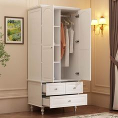 a white armoire with drawers in a room