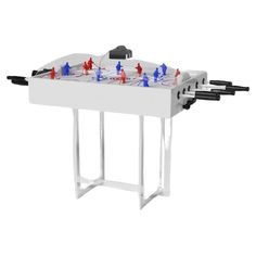 an ice hockey table with red, white and blue figures on it's sides