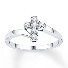 This lovely cross ring for her is fashioned in sterling silver with round diamonds. The ring has a total diamond weight of 1/5 carat. Casual Rings, Jewelry Advice, Diamond Cross, Cross Ring, The Ring, Rings For Her, Vintage Diamond, Unique Engagement Rings, Metal Jewelry