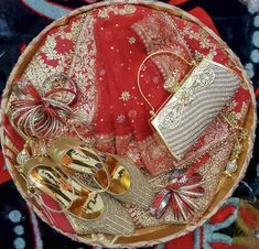 a basket filled with gold and red items