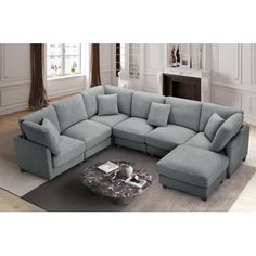 a living room with a sectional couch and coffee table