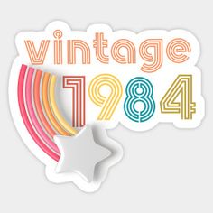 a sticker with the words vintage in rainbow colors and a white star on it