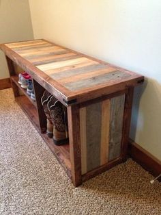 a wooden bench sitting on top of a carpeted floor