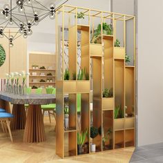 a room filled with lots of furniture and plants on top of wooden shelves next to a dining table