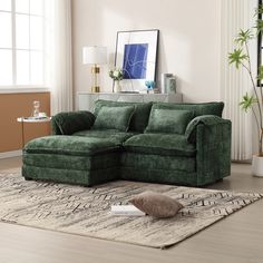 a green couch sitting on top of a rug in a living room