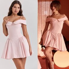 two women in short dresses one is wearing a pink dress and the other has a white shirt