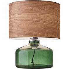 a green glass table lamp with a wooden shade on the base and a white background