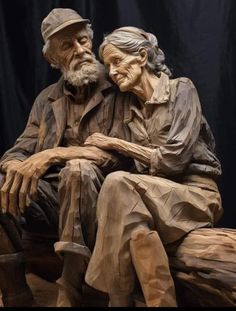 an old man and woman sitting next to each other on top of a wooden bench