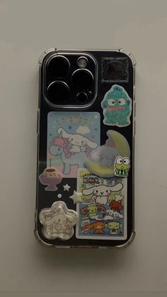 an open cell phone case with stickers on it