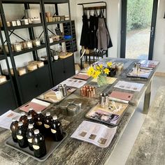 the table is set up with bottles and jars