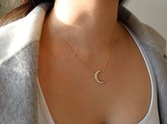 This beautiful Pearl Moon Necklace is the perfect combination of bold and elegant. The crescent moon pendant is adorned with pearls with a single gemstone on the chain, perfect for wearing alone or layered with our simple stand of pearl. A piece that can be worn with your favorite tee or weekend getaway outfit. Details: -The length of the Pearl Moon Necklace is 16 inches + 2 inch extender chain -Moon with tiny pearls measures 20mm x 21mm -Gold Vermeil (gold over sterling silver) SHIPPING & P Sterling Silver Choker Necklace, Getaway Outfit, Star And Moon Necklace, Gold Moon Necklace, Modern Gold Jewelry, Pearl Strands Necklace, Gray Jewelry, Sterling Silver Choker, Silver Choker Necklace